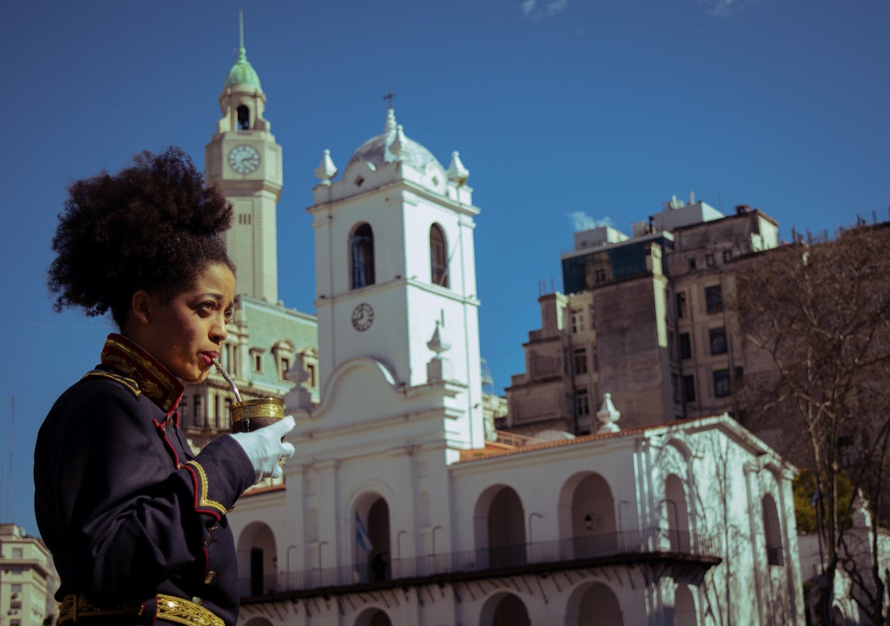 A traditional military ceremony at Buenos Aires' historic Cabildo with an officer holding a mate drink.
