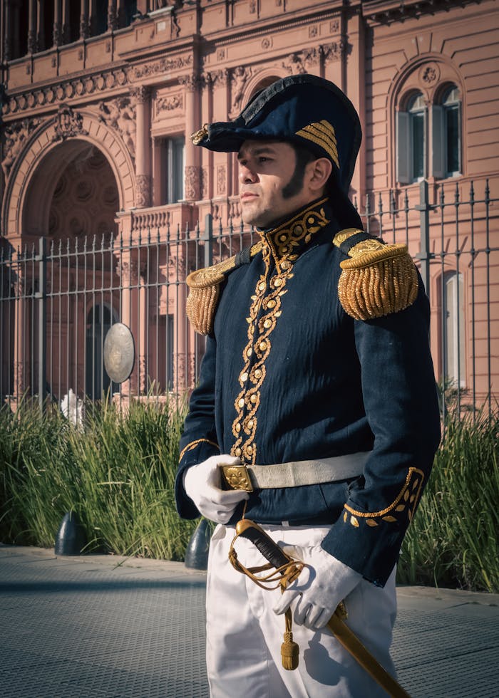 A historic guard in traditional uniform stands at Casa Rosada, Buenos Aires.